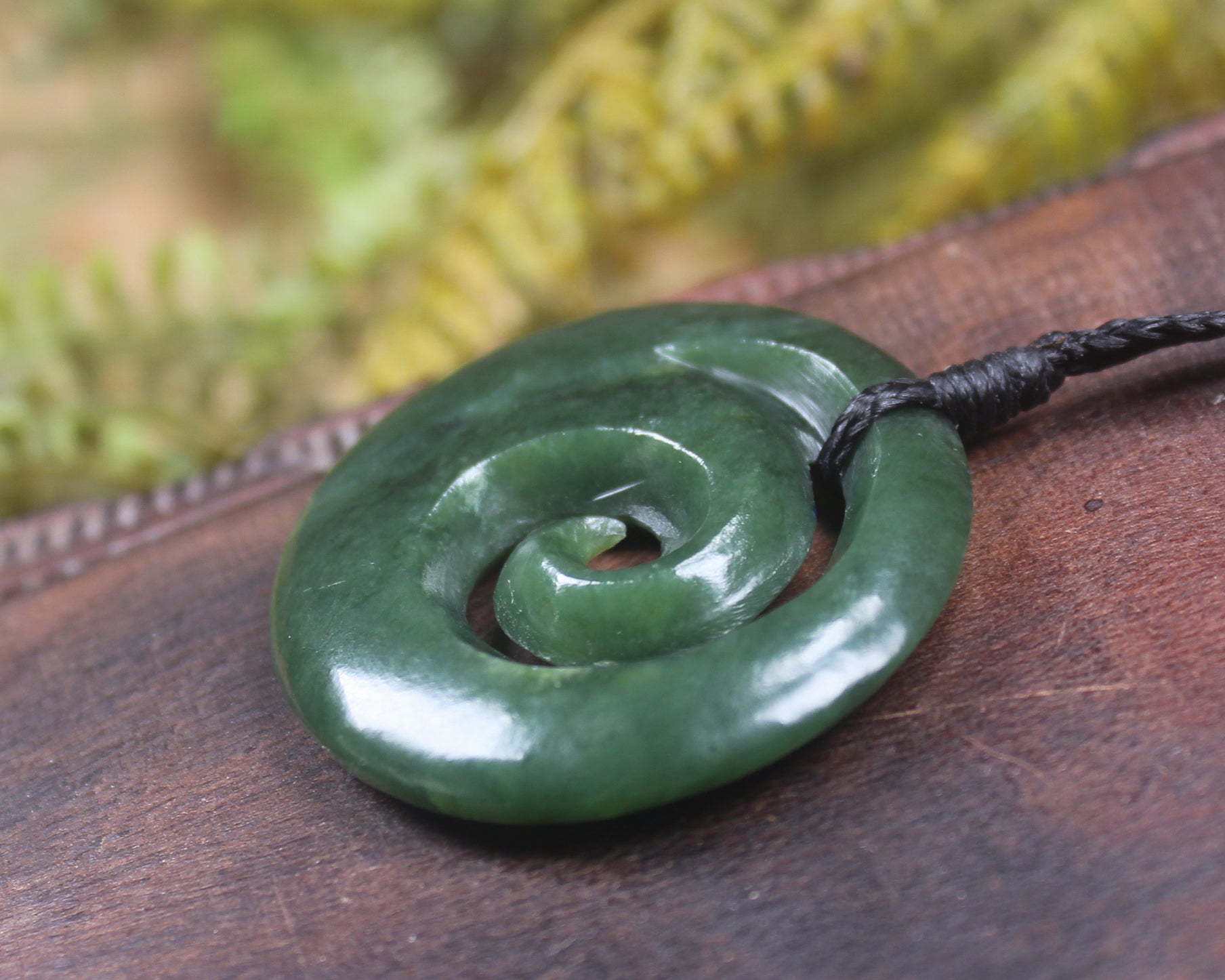 Koru pendant carved from Kawakawa Pounamu - NZ Greenstone