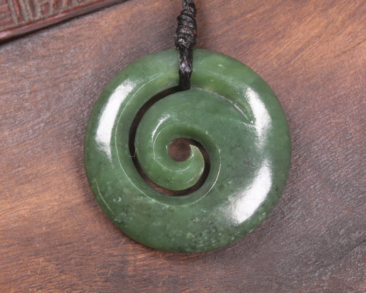 Koru pendant carved from Kawakawa Pounamu - NZ Greenstone