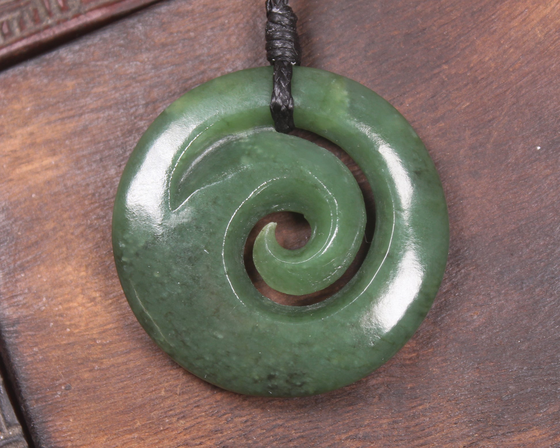 Koru pendant carved from Kawakawa Pounamu - NZ Greenstone