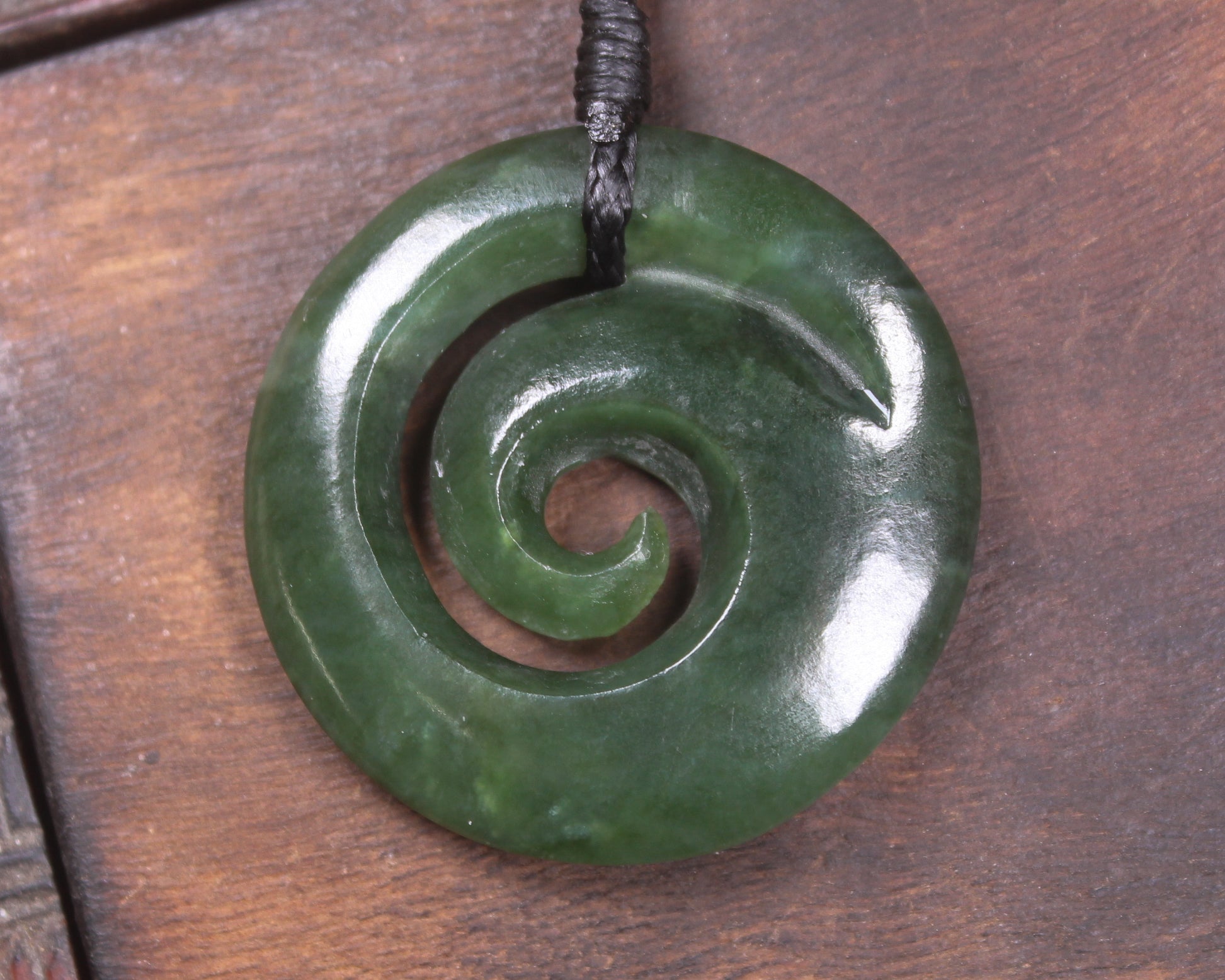Koru pendant carved from Kawakawa Pounamu - NZ Greenstone