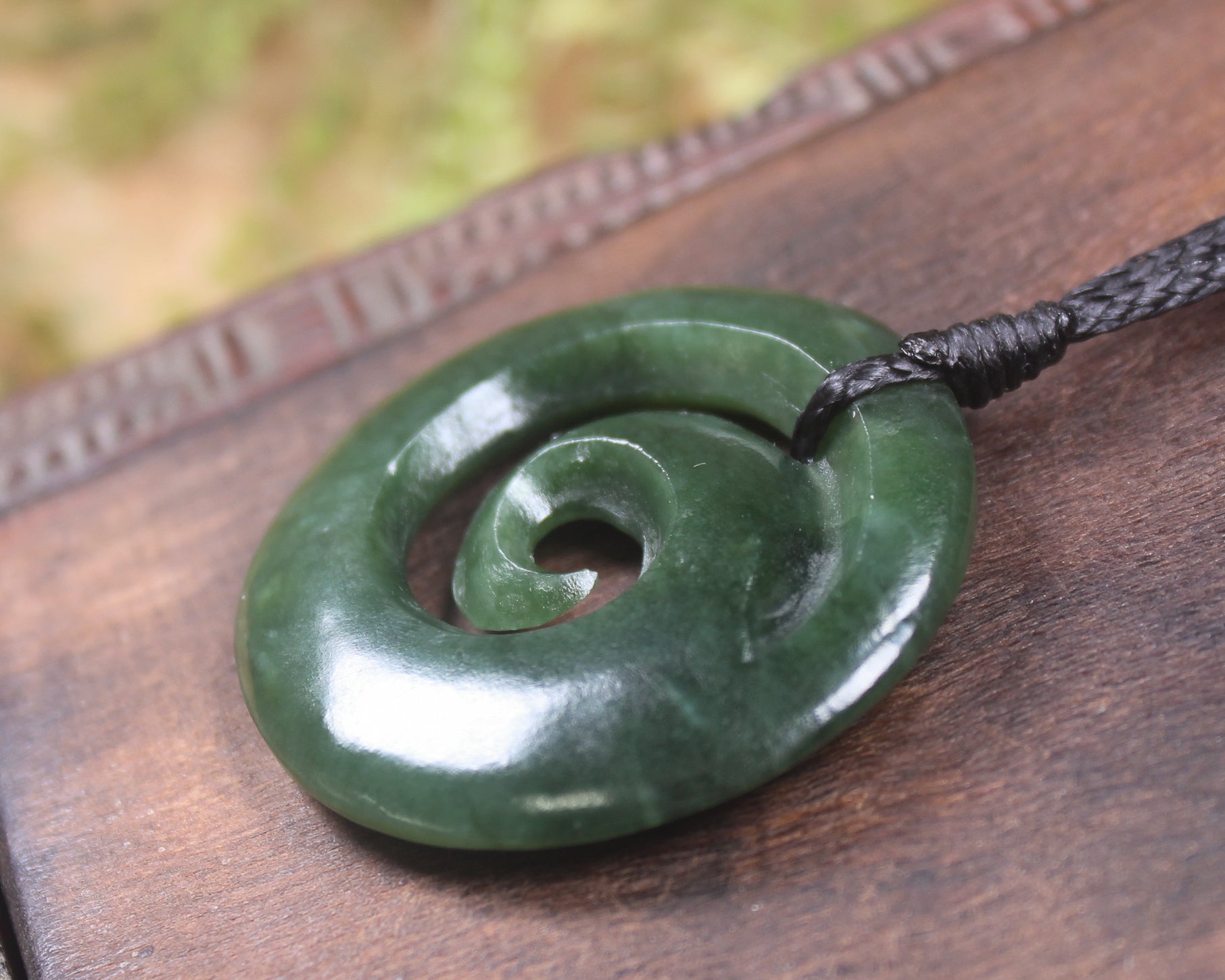 Koru pendant carved from Kawakawa Pounamu - NZ Greenstone