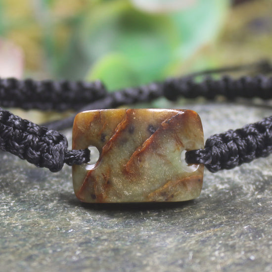 Adjustable cord bracelet with Totoweka Pounamu
