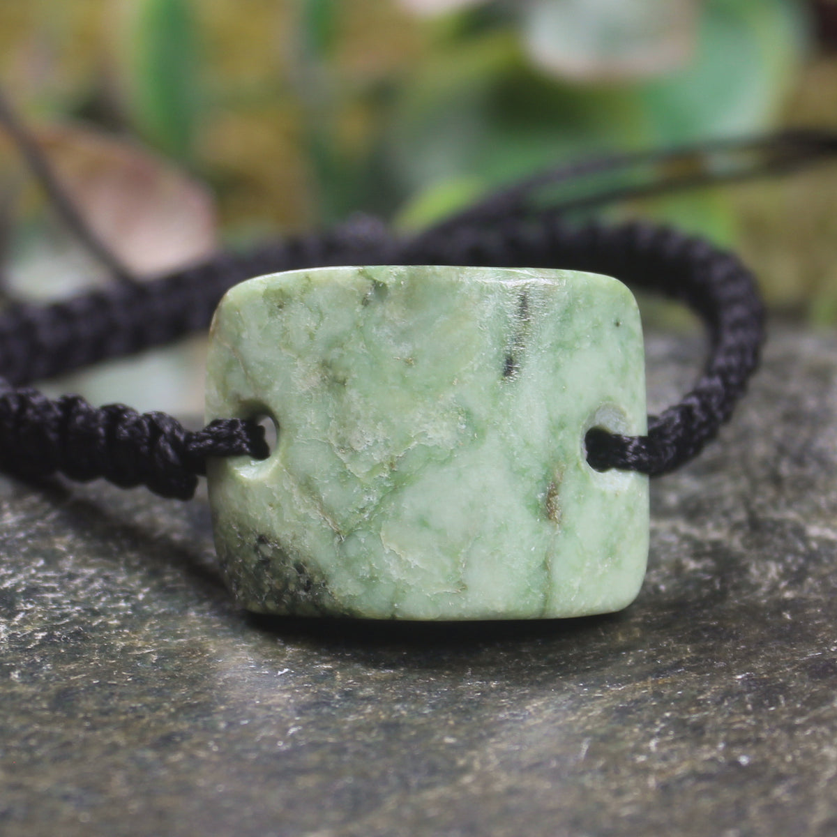 Adjustable cord bracelet with Kawakawa Pounamu
