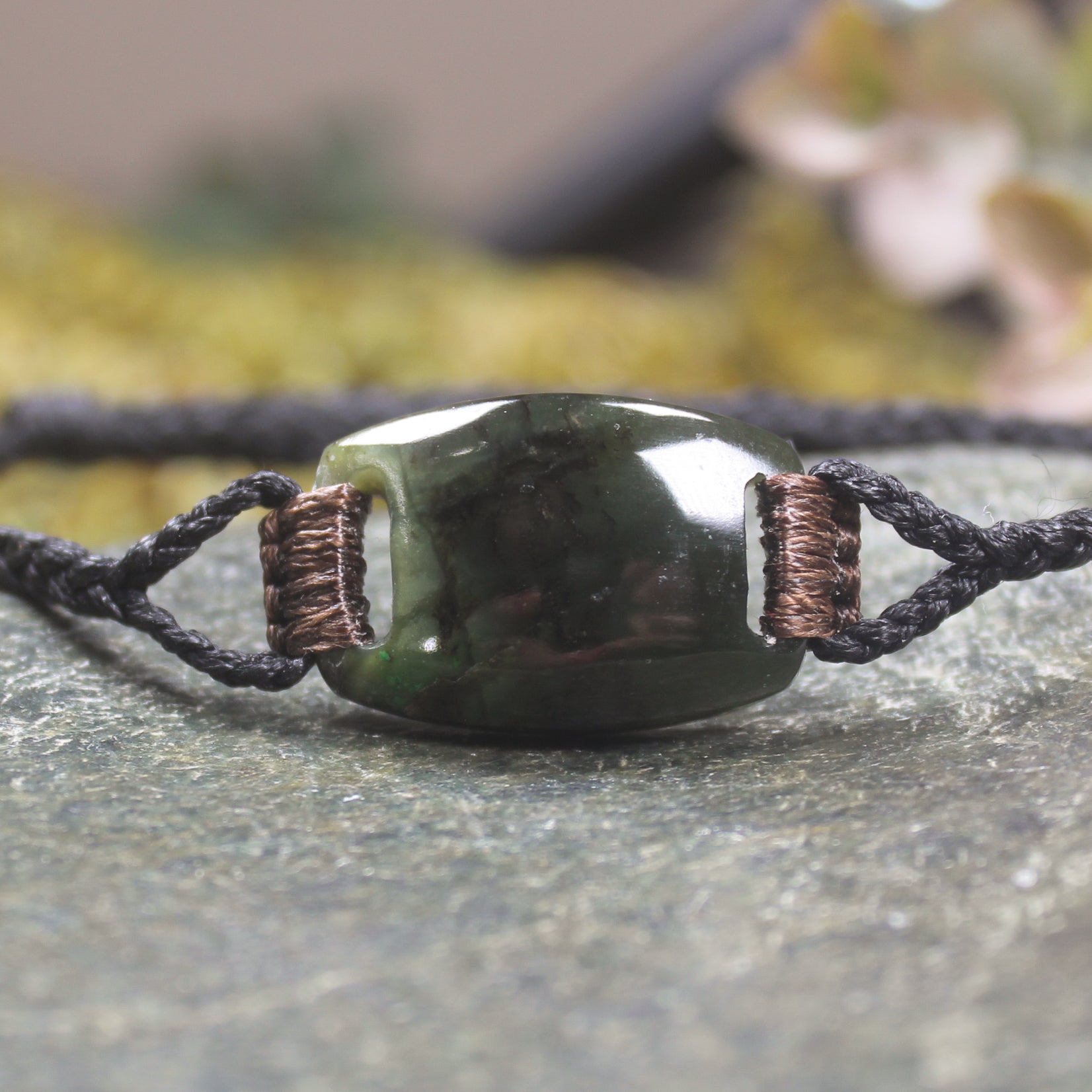 Adjustable cord bracelet with Rimu Pounamu