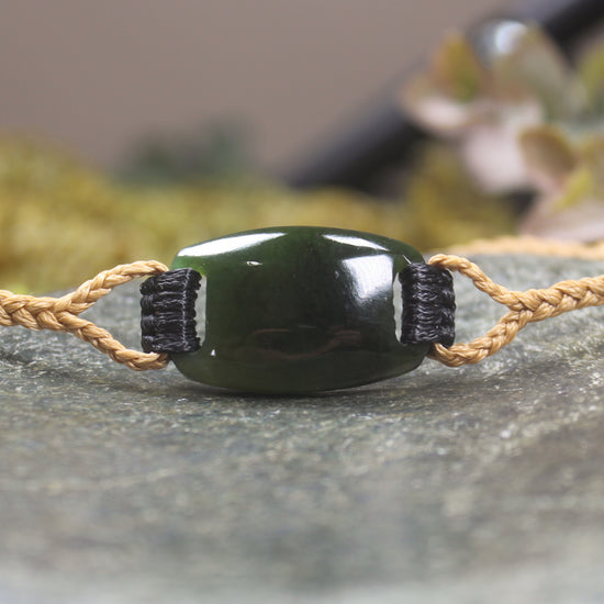 Adjustable cord bracelet with Rimu Pounamu