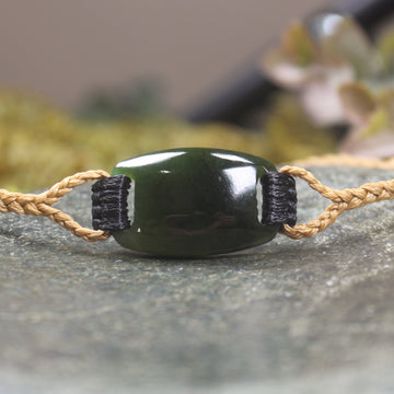 Adjustable cord bracelet with Rimu Pounamu