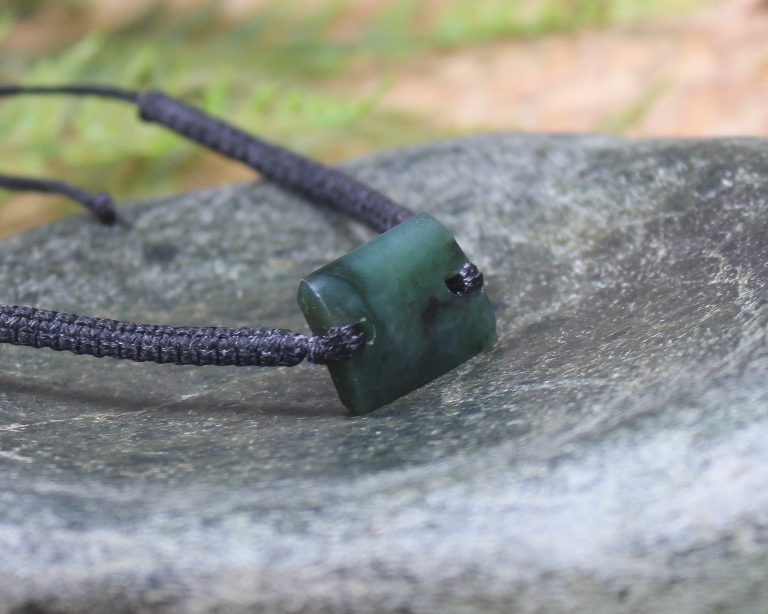 Adjustable cord bracelet with Rimu Pounamu