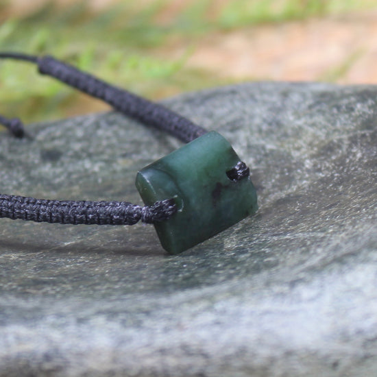Adjustable cord bracelet with Rimu Pounamu