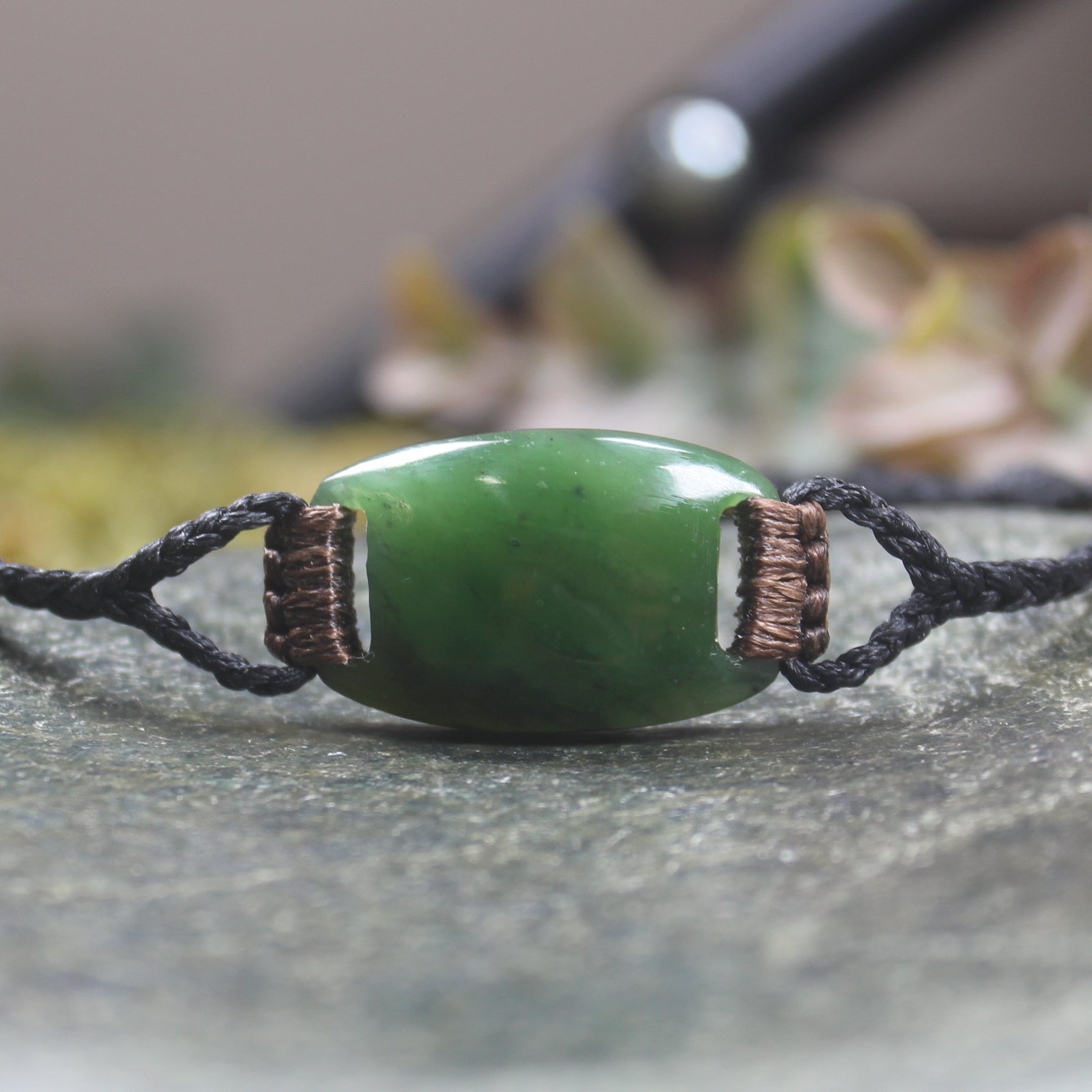 Adjustable cord bracelet with Kawakawa Pounamu