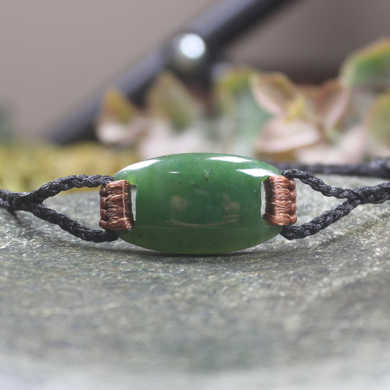 Adjustable cord bracelet with Hapopo Pounamu