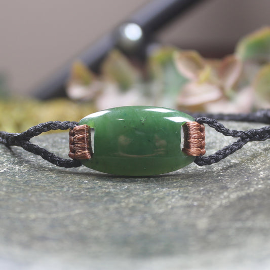 Adjustable cord bracelet with Hapopo Pounamu