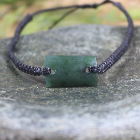 Adjustable cord bracelet with Rimu Pounamu