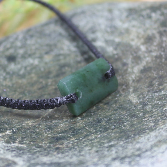 Adjustable cord bracelet with Rimu Pounamu