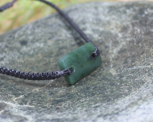 Adjustable cord bracelet with Rimu Pounamu