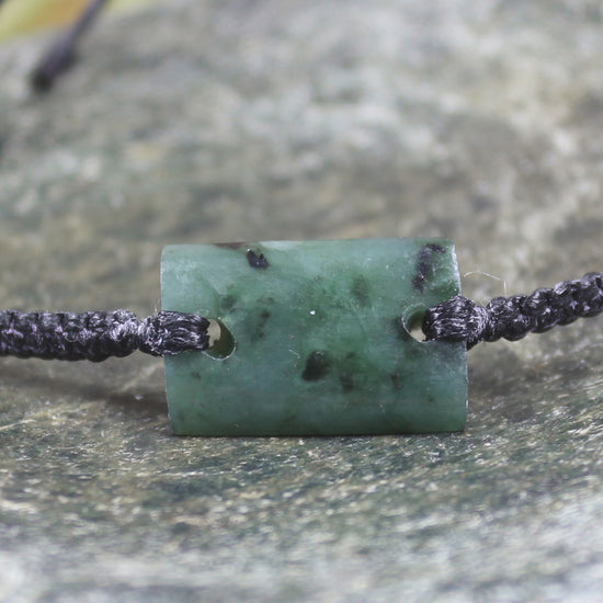 Adjustable cord bracelet with Rimu Pounamu