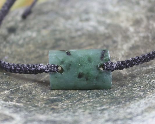 Adjustable cord bracelet with Rimu Pounamu