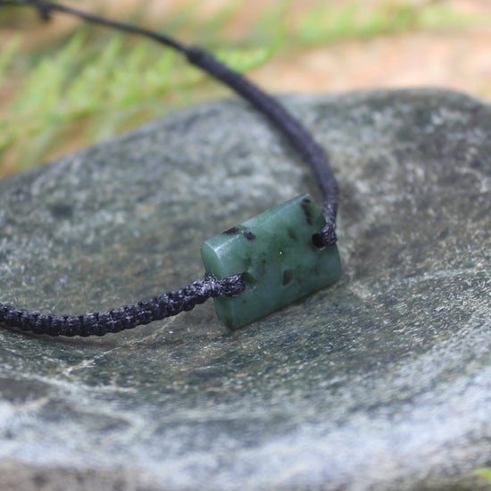 Adjustable cord bracelet with Rimu Pounamu