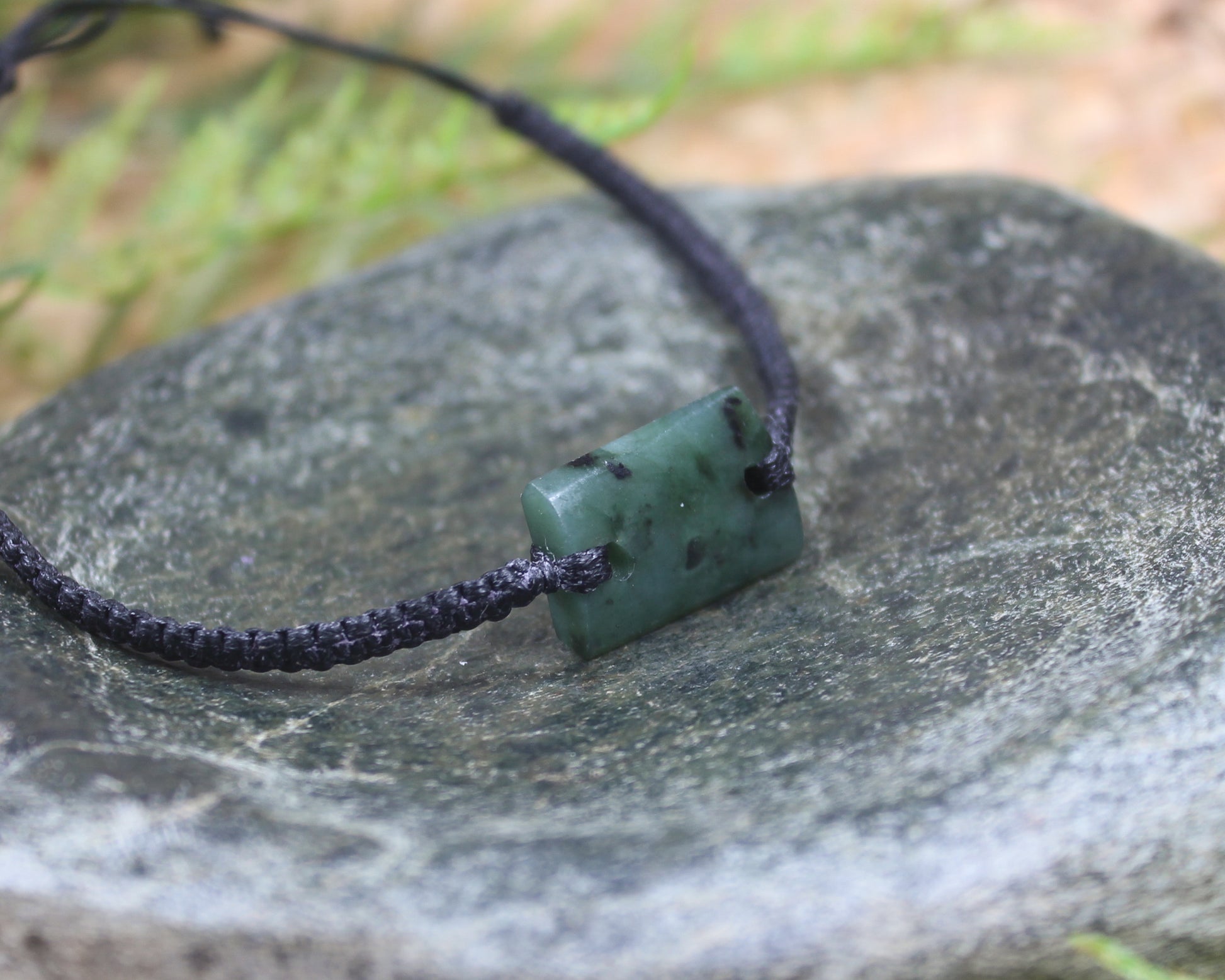 Adjustable cord bracelet with Rimu Pounamu