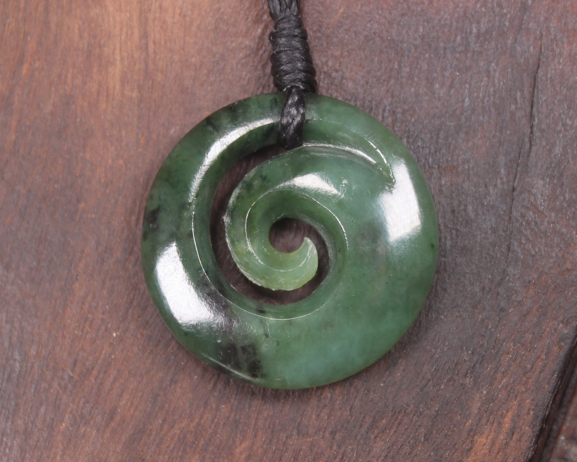 Koru pendant carved from Kawakawa Pounamu - NZ Greenstone