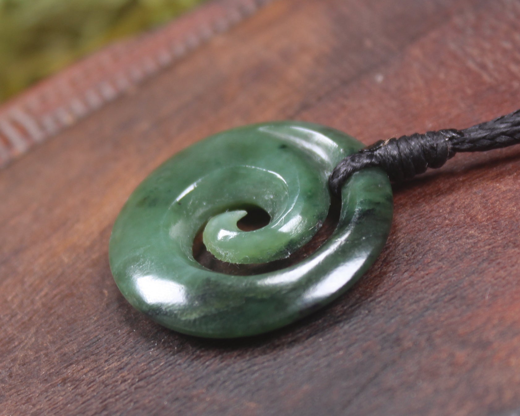 Koru pendant carved from Kawakawa Pounamu - NZ Greenstone