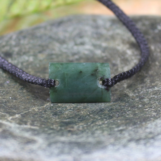 Adjustable cord bracelet with Rimu Pounamu