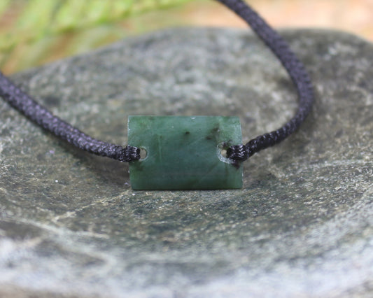 Adjustable cord bracelet with Rimu Pounamu