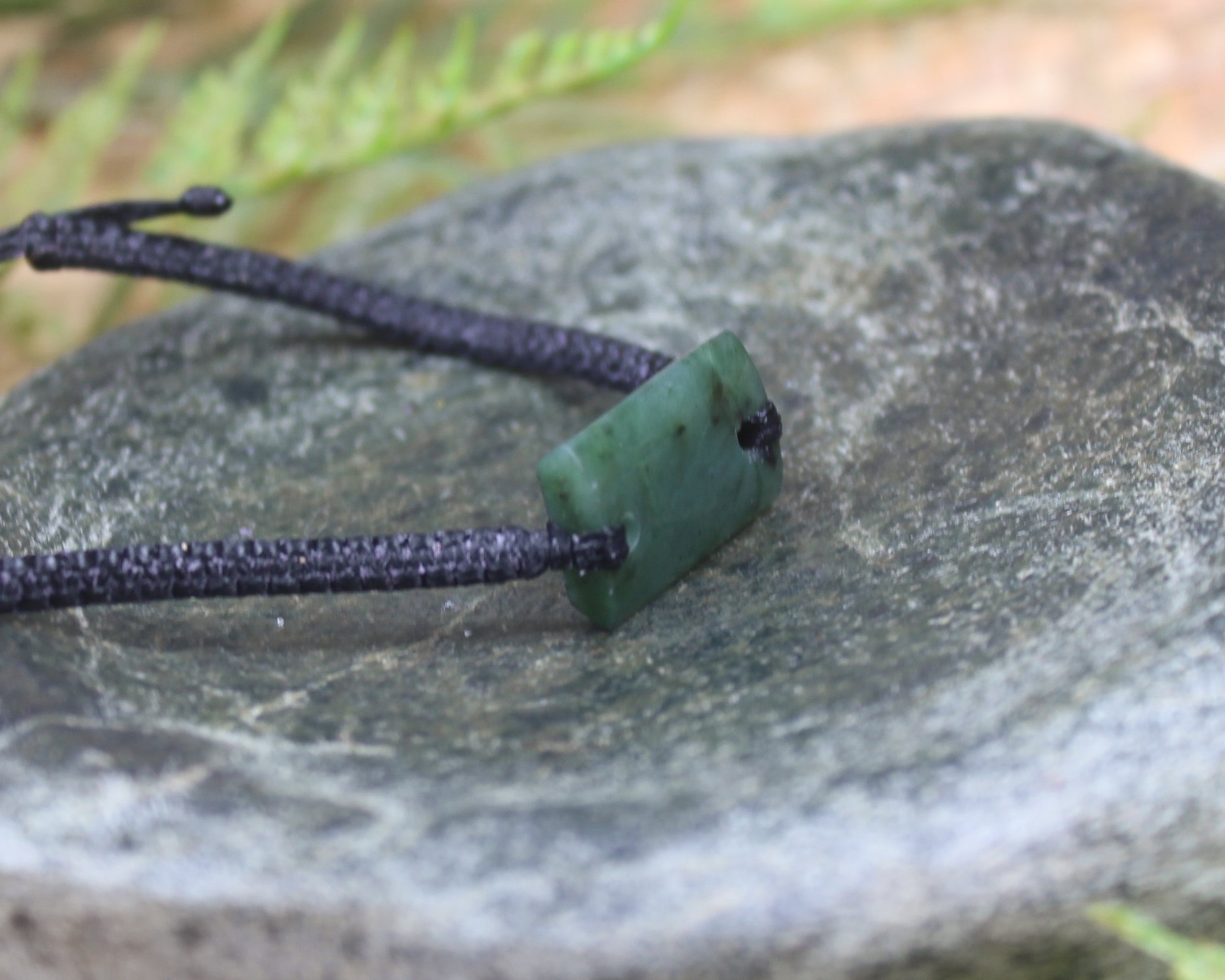 Adjustable cord bracelet with Rimu Pounamu