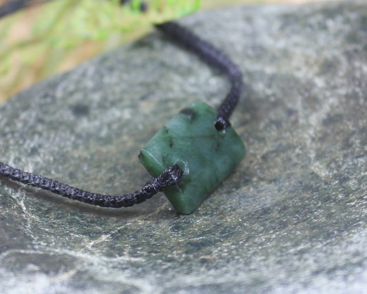 Adjustable cord bracelet with Rimu Pounamu