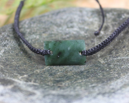 Adjustable cord bracelet with Rimu Pounamu