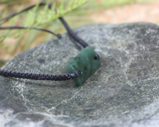 Adjustable cord bracelet with Rimu Pounamu