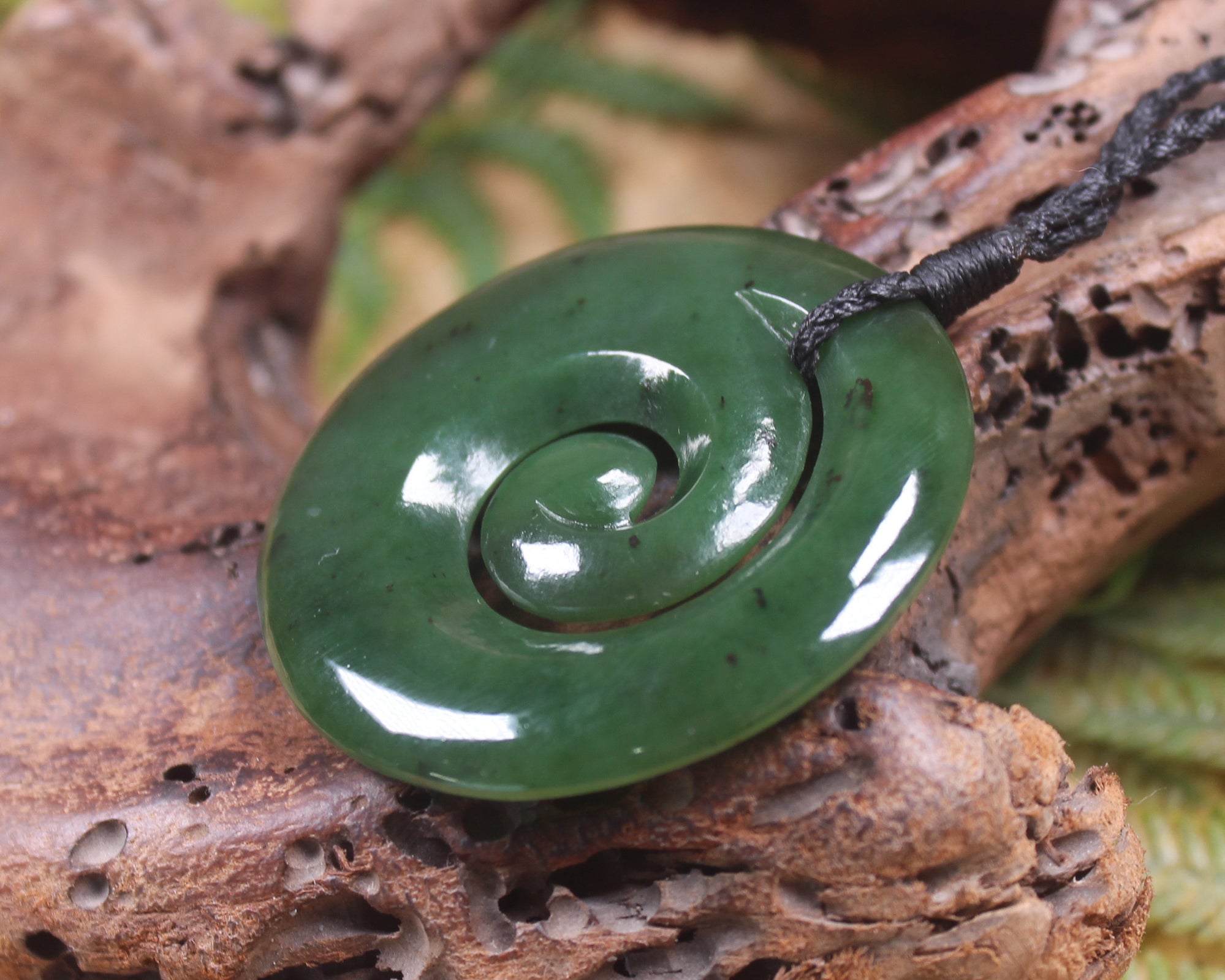 Koru pendant carved from Kawakawa Pounamu - NZ Greenstone