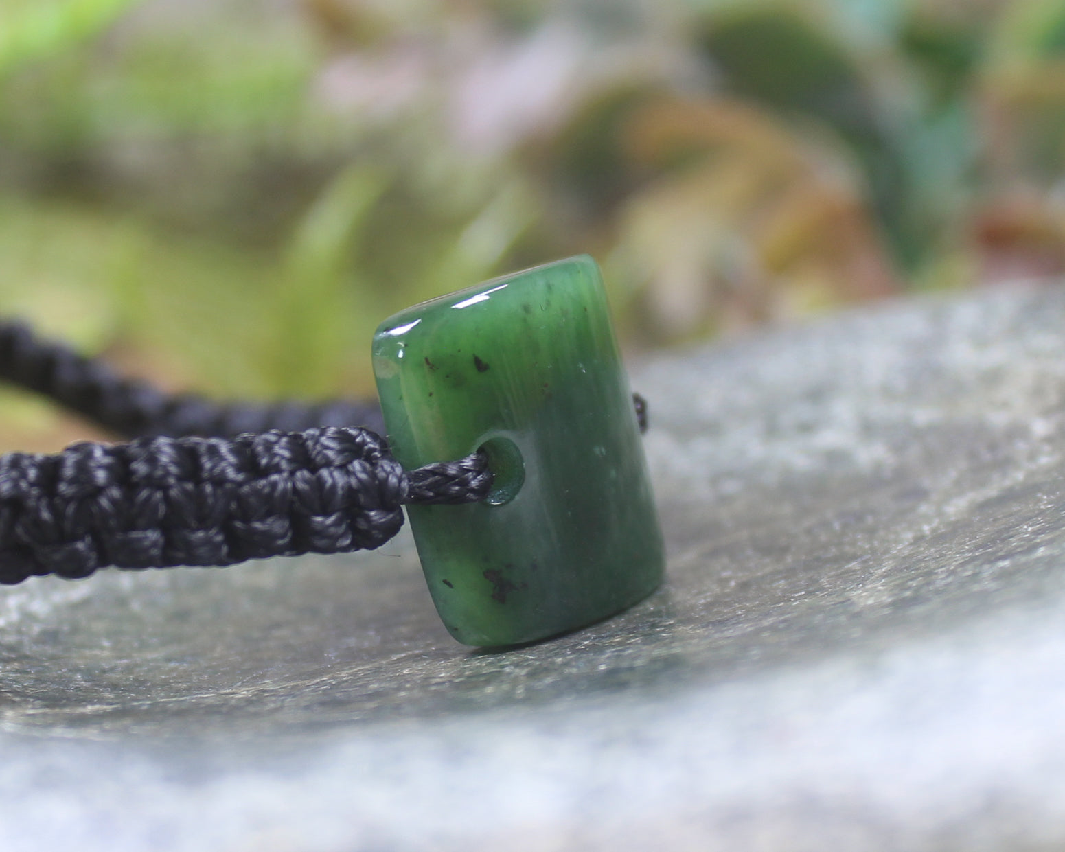 Adjustable cord bracelet with Kawakawa Pounamu