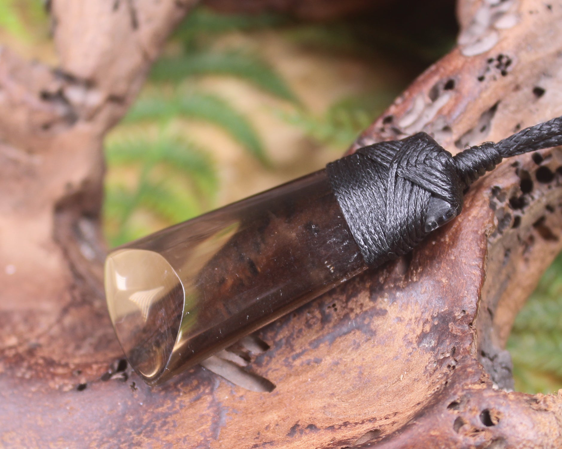 Toki pendant carved from Smokey Quartz