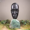 Mask sculpture carved from recycled wood