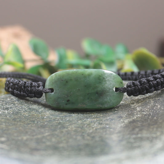 Adjustable cord bracelet with Hapopo Pounamu