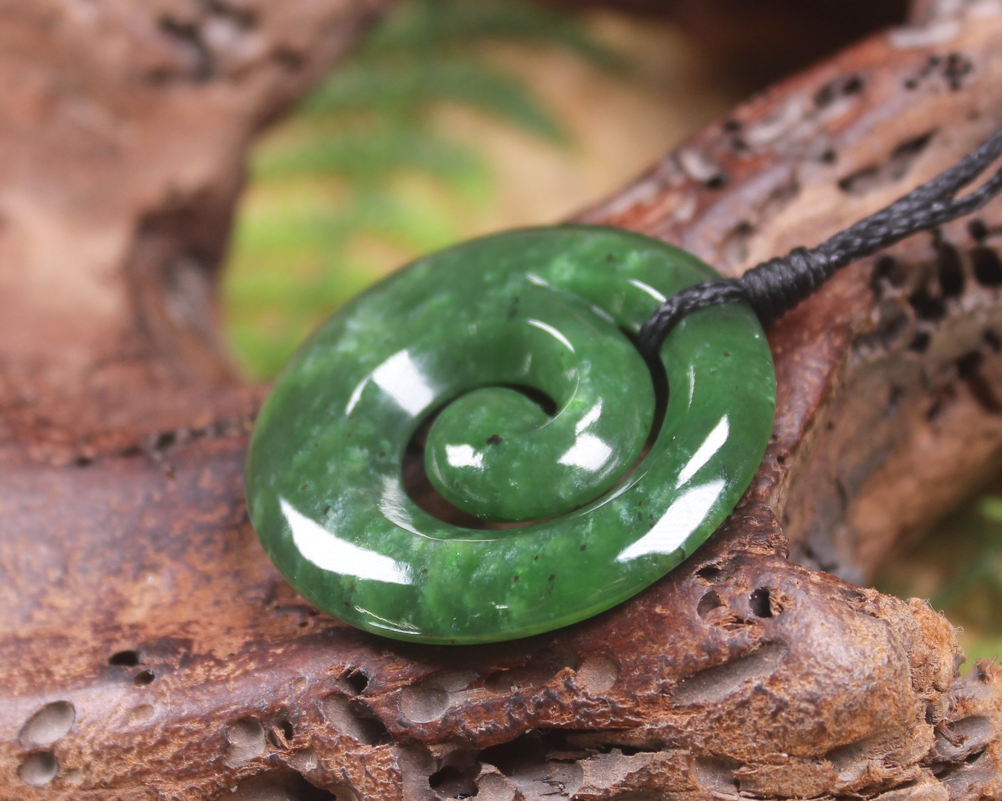 Koru pendant carved from Kawakawa Pounamu - NZ Greenstone
