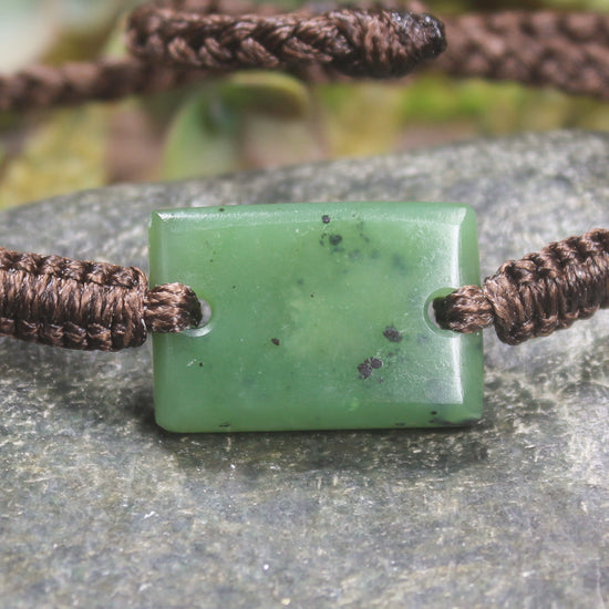 Adjustable cord bracelet with Hapopo Pounamu