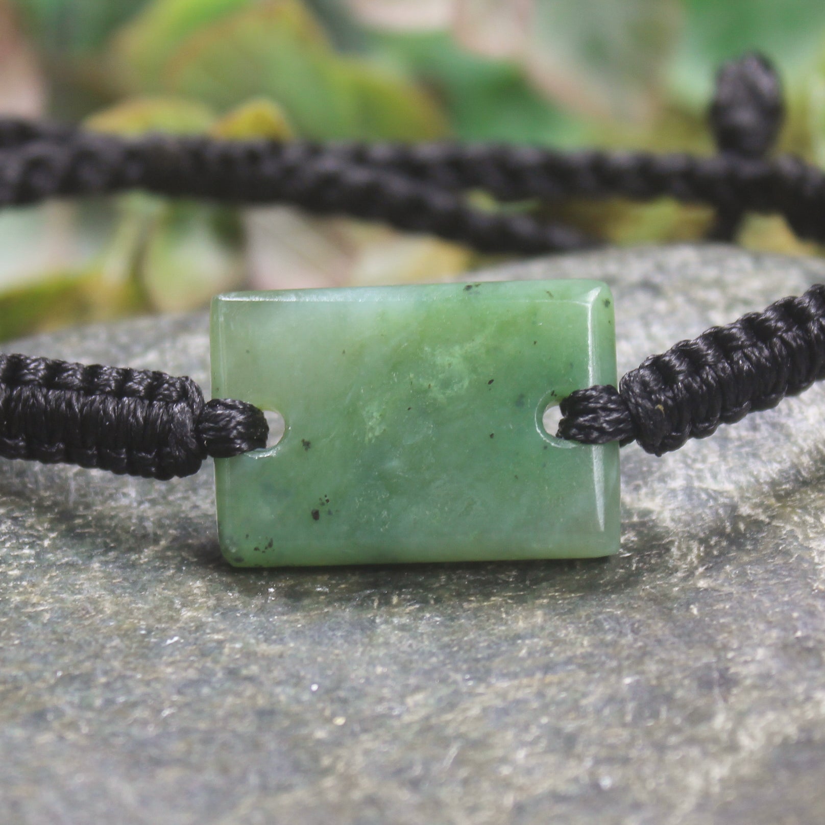 Adjustable cord bracelet with Hapopo Pounamu