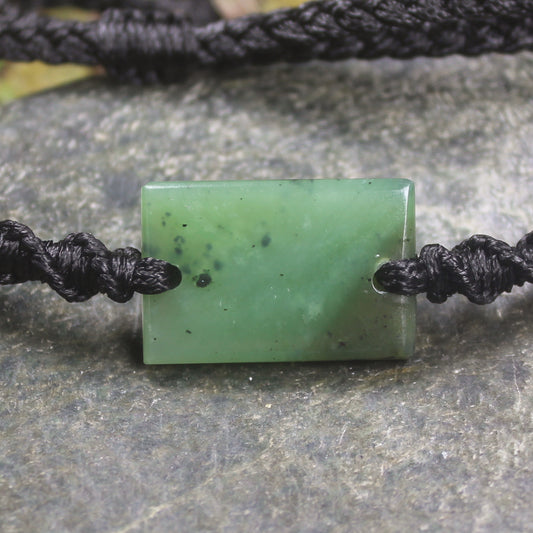 Adjustable cord bracelet with Hapopo Pounamu