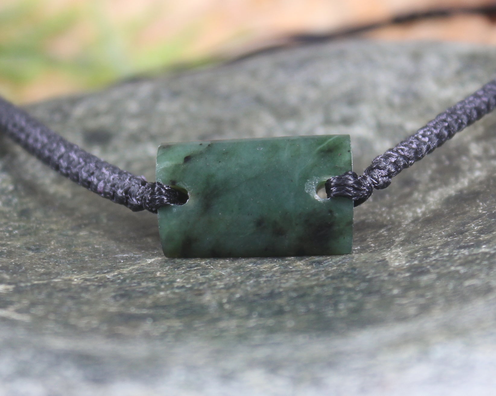 Adjustable cord bracelet with Rimu Pounamu