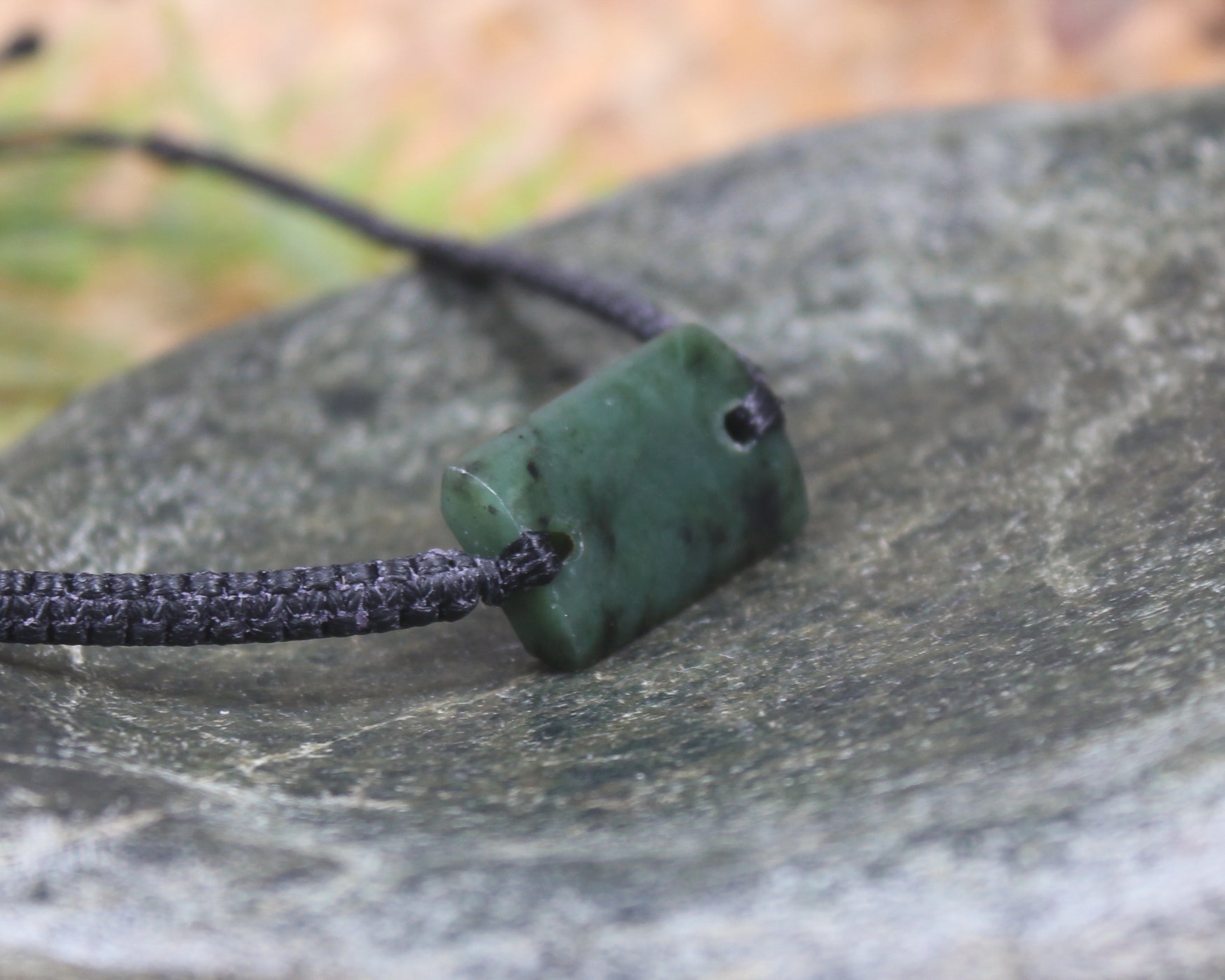 Adjustable cord bracelet with Rimu Pounamu