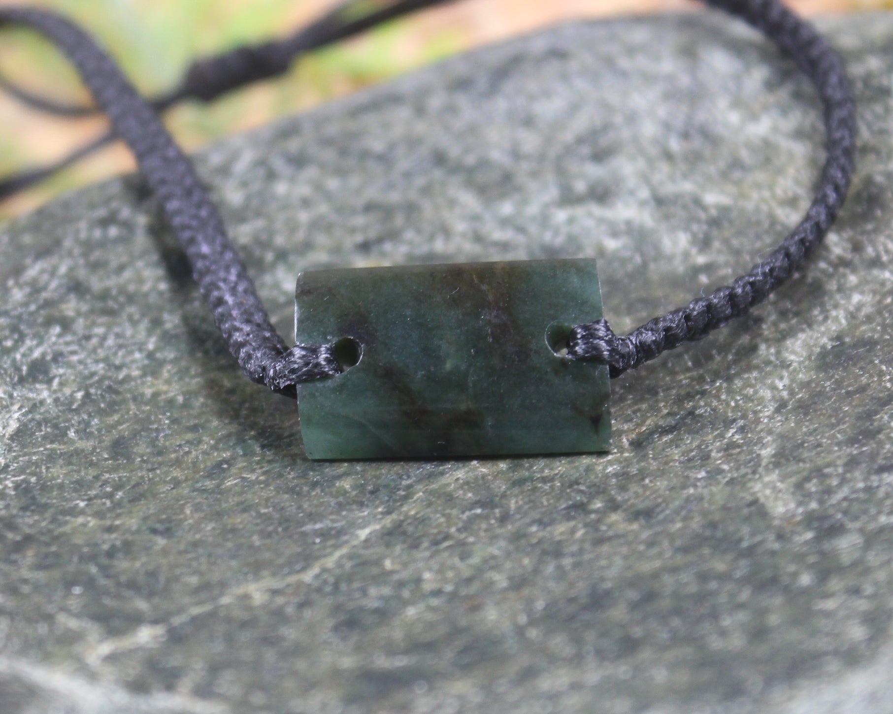 Adjustable cord bracelet with Rimu Pounamu