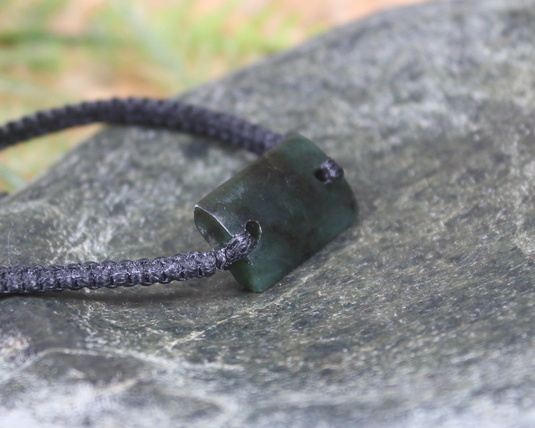 Adjustable cord bracelet with Rimu Pounamu