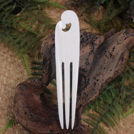 Heru with Koru carved from beef bone