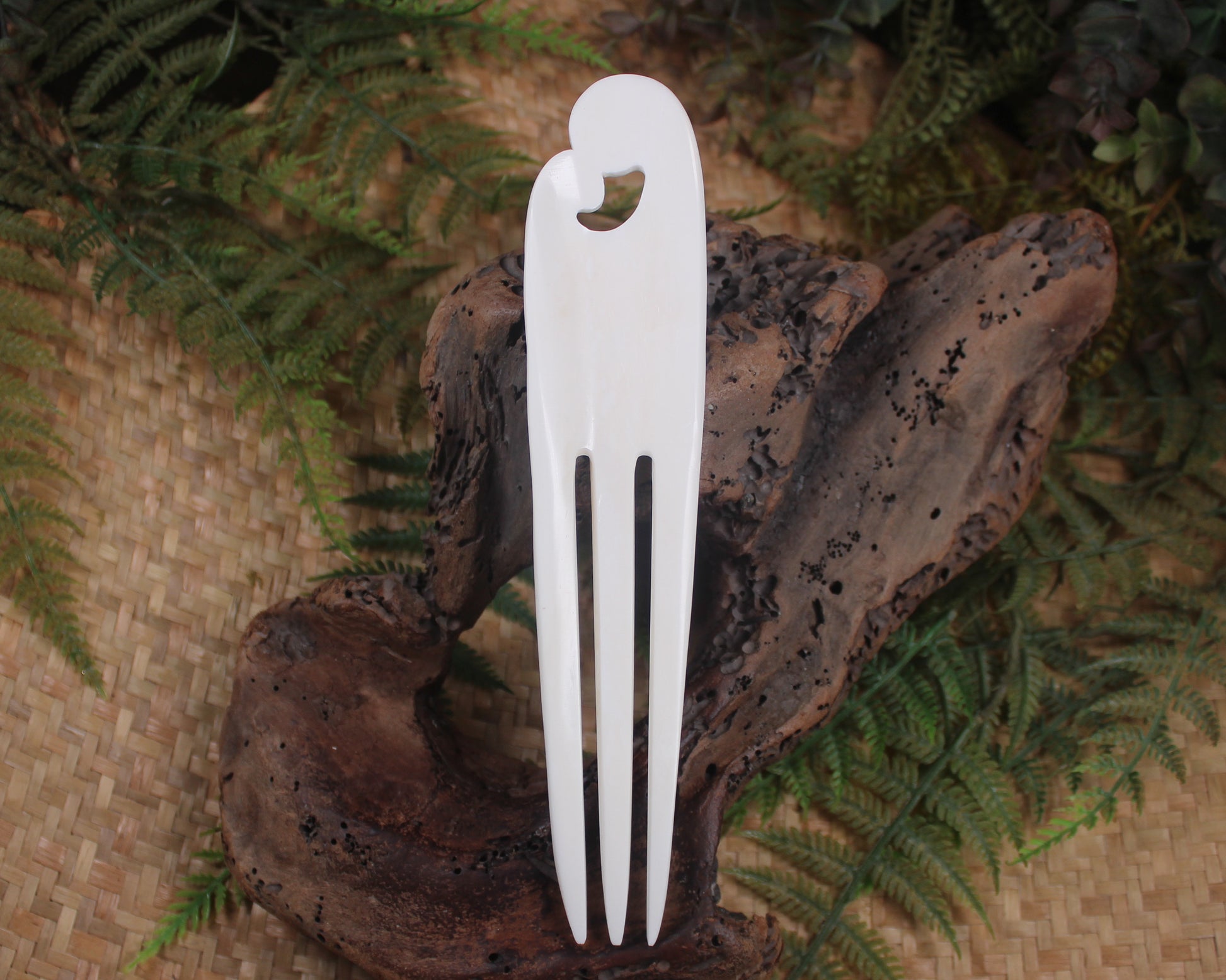 Heru with Koru carved from beef bone