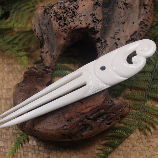 Heru with Koru carved from beef bone