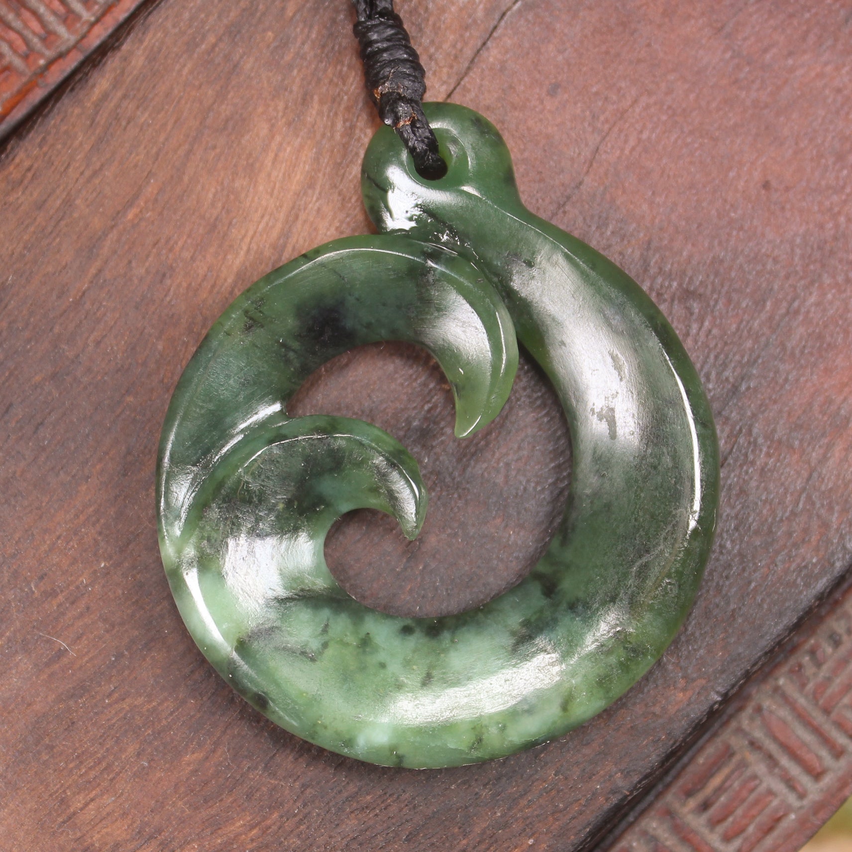 Koru Twist Pendant carved from Rimu Pounamu - NZ Greenstone