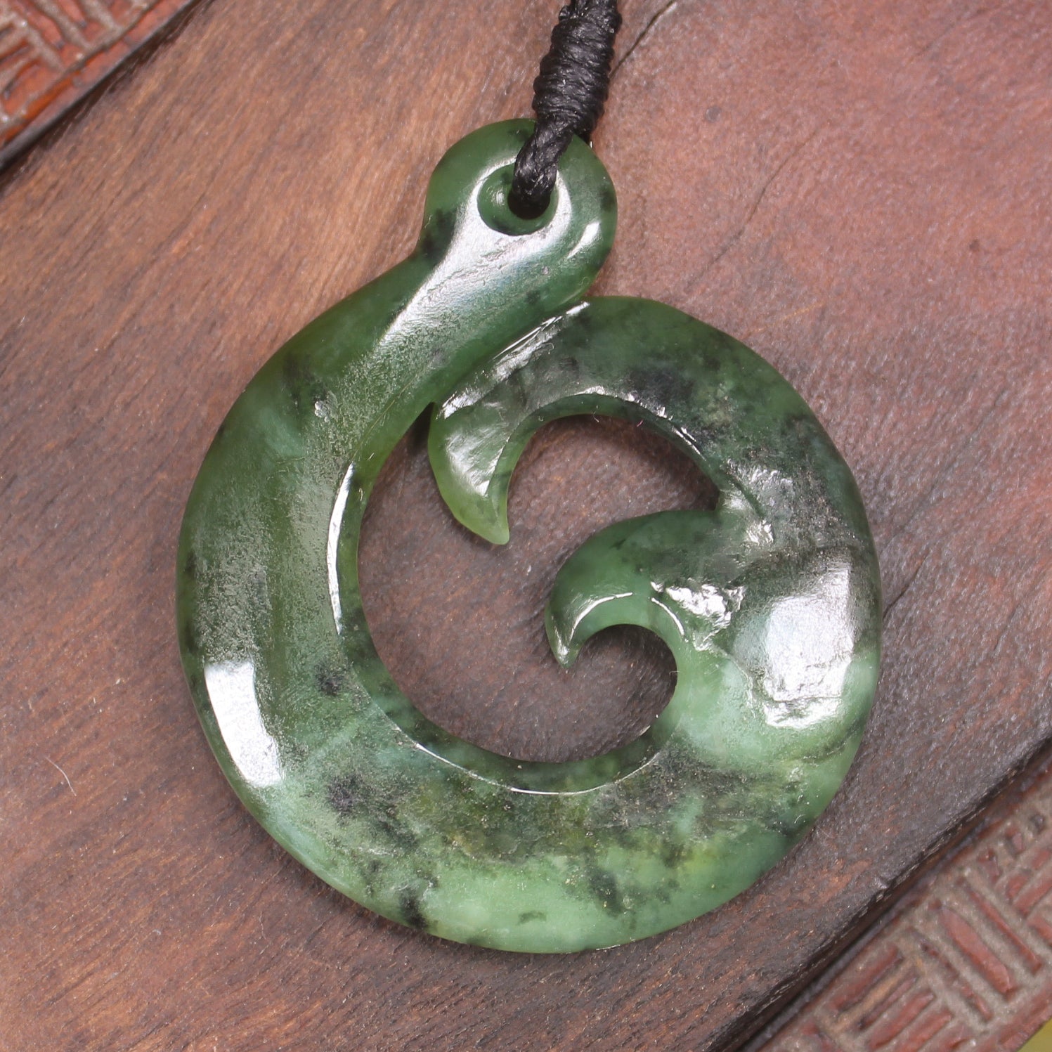 Koru Twist Pendant carved from Rimu Pounamu - NZ Greenstone