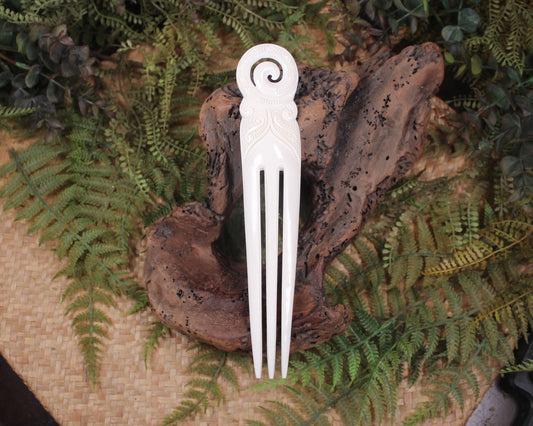 Heru with Koru carved from beef bone