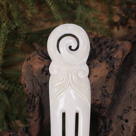 Heru with Koru carved from beef bone